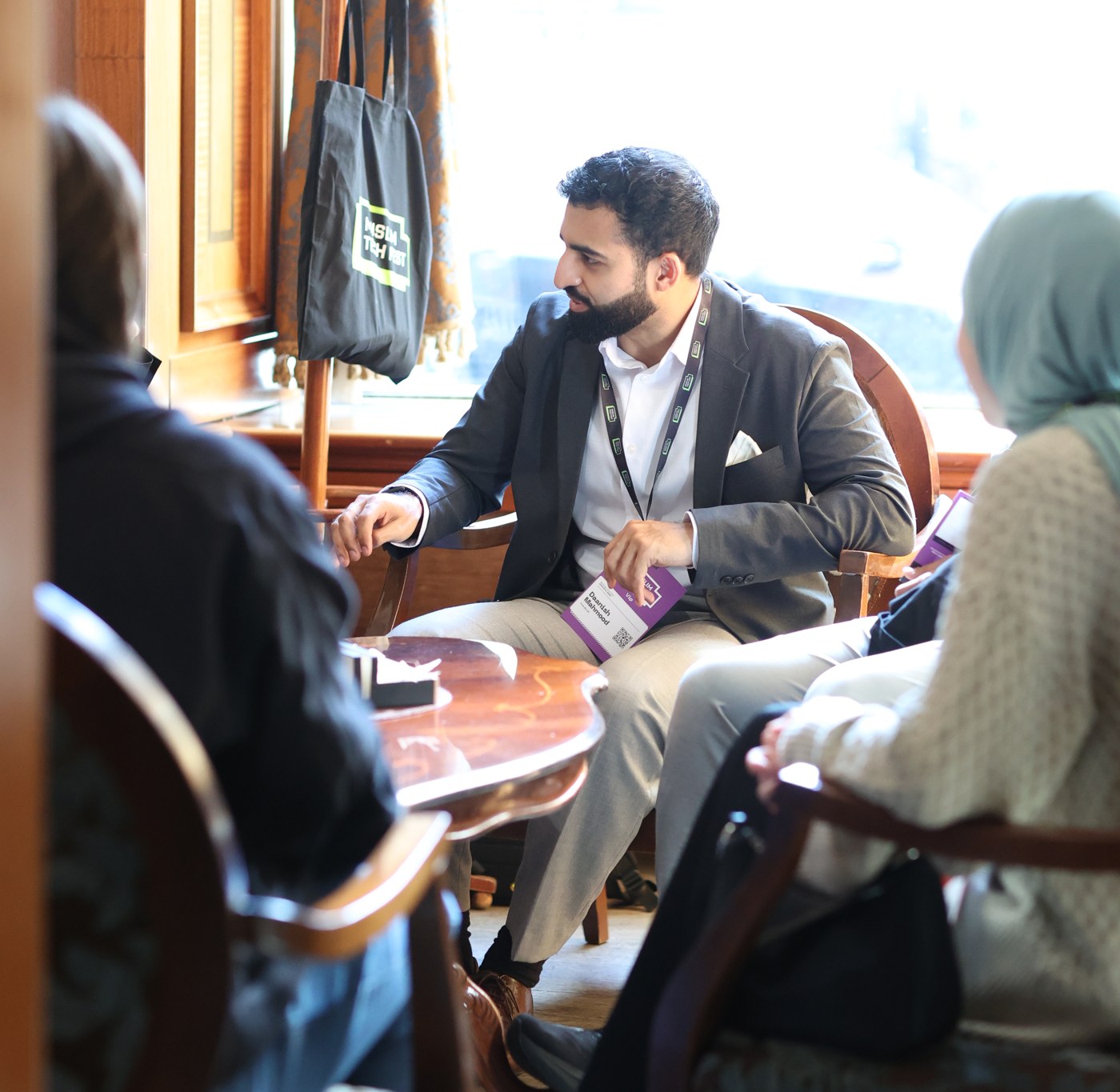 Daanish in conversation with two people at Muslim Tech Fest